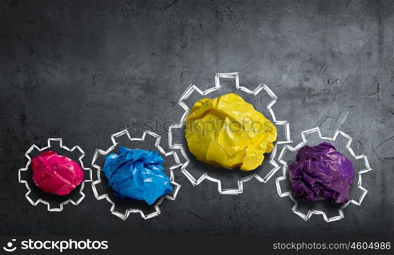 In search of creative idea. Set of colourful crumpled paper balls on grey surface