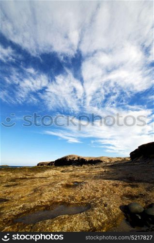 in spain lanzarote rock stone sky cloud beach water musk pond coastline and summer