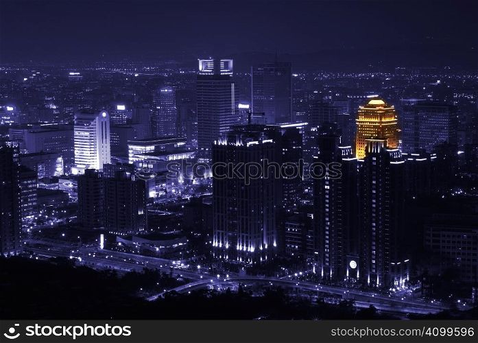 In Taipei lonely night, only one building has orange loght at purple city.