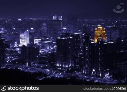 In Taipei lonely night, only one building has orange loght at purple city.