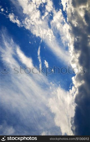 in the busto arsizio lombardy italy varese abstract ckoudy sky and sun beam