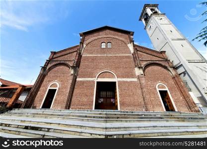 in the cardano al campo old church closed brick tower sidewalk italy lombardy