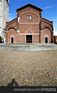 in the cardano al campo old church closed brick tower sidewalk italy lombardy
