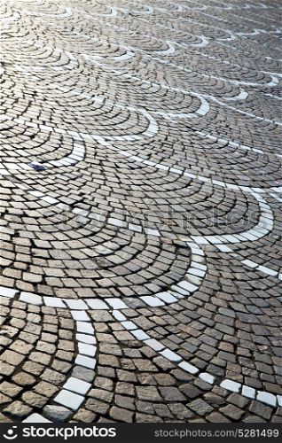 in the castano primo street lombardy italy varese abstract pavement of a curch and marble