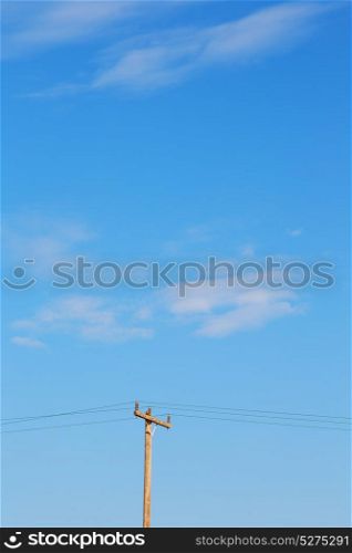 in the cloudy sky and abstract background current pole electricity line