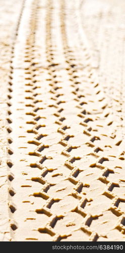 in the desert beach track of car and truck in the sand like abstract background