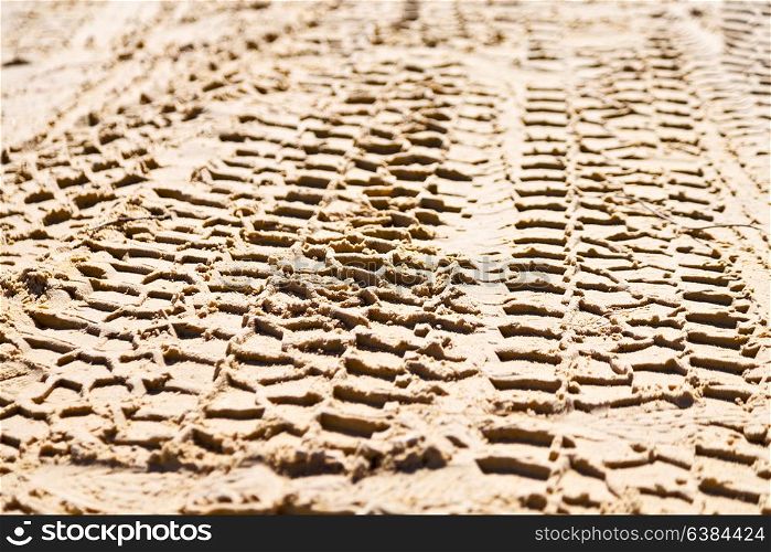 in the desert beach track of car and truck in the sand like abstract background