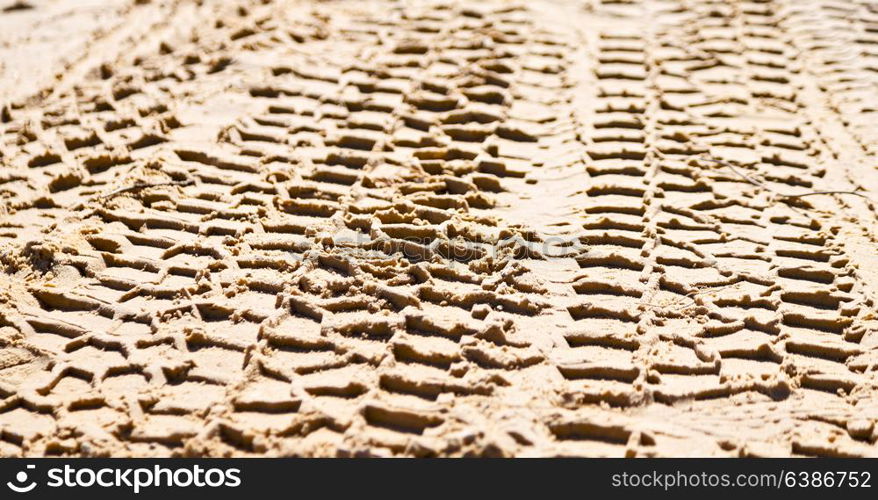 in the desert beach track of car and truck in the sand like abstract background