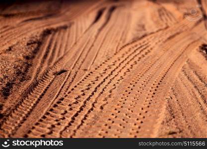 in the desert track of car and truck in the sand like abstract background