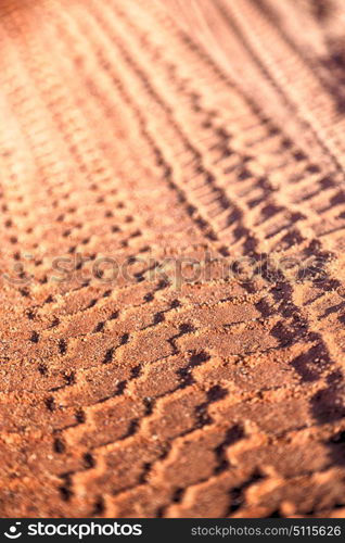 in the desert track of car and truck in the sand like abstract background