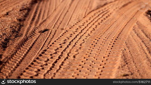 in the desert track of car and truck in the sand like abstract background