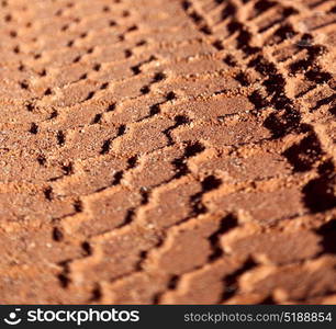 in the desert track of car and truck in the sand like abstract background