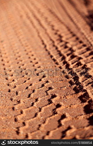 in the desert track of car and truck in the sand like abstract background