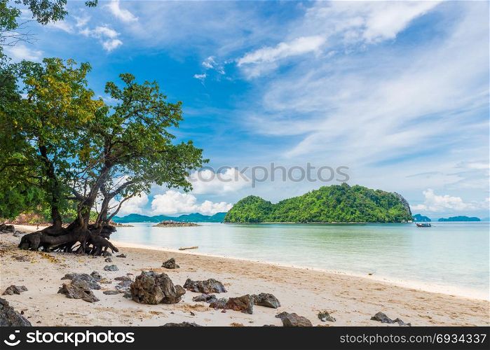 in the frame tree, beach, Andaman Sea and beautiful mountains on the horizon, Thayland, Krabi resort