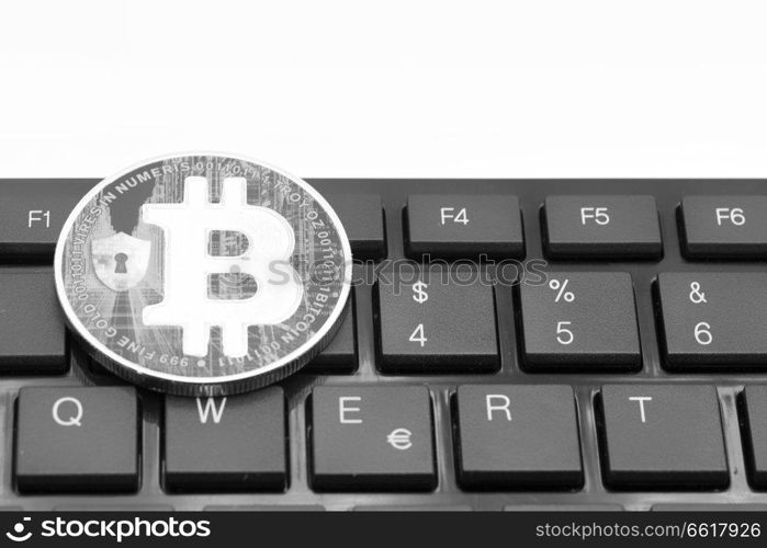 in the keyboard of a computer the coin of bitcoin like concept of future and investment
