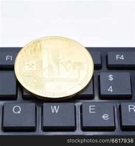 in the keyboard of a computer the coin of bitcoin like concept of future and investment
