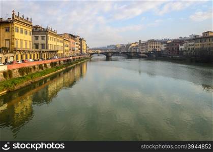In the picture a view of Arno river with its characteristic bridges , Florence .