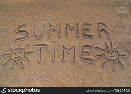 "In the picture the words on the sand "Summer time""
