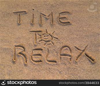 "In the picture the words on the sand "Time to relax""