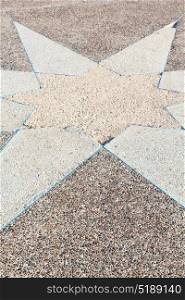 in the sidewalk star made of stone like background