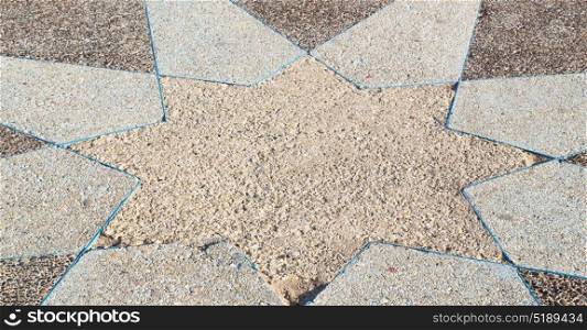 in the sidewalk star made of stone like background