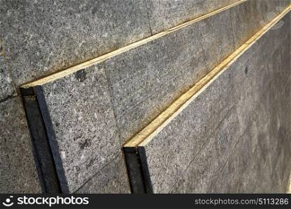 in the turbigo street lombardy italy varese abstract pavement of a curch and marble
