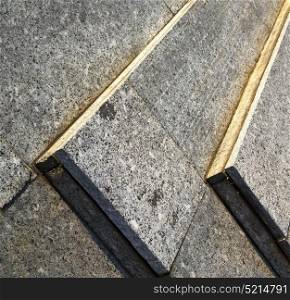 in the turbigo street lombardy italy varese abstract pavement of a curch and marble