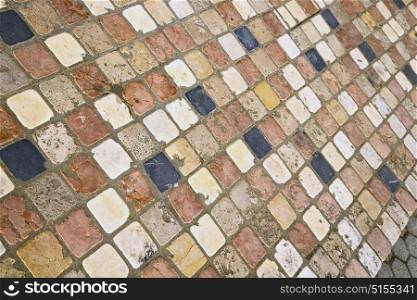 in the varano borghi street lombardy italy varese abstract pavement of a curch and marble