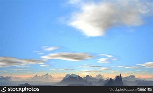 In the vast blue sky slowly floating clouds. Mountain covered blym fog. The horizon goes bright white sun rises above the clouds