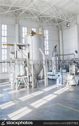 in the workshop machines for processing and manufacturing of plastic granules. a factory for processing plastic granules. PET. factory for the production of pet plastic granules. plant of PET granules
