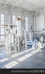 in the workshop machines for processing and manufacturing of plastic granules. a factory for processing plastic granules. PET. factory for the production of pet plastic granules. plant of PET granules