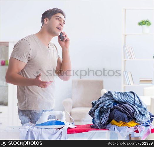 Inattentive husband burning clothing while ironing. The inattentive husband burning clothing while ironing