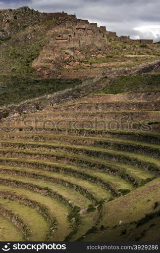 Inca ruins and terraces at Qantus Raqay in the Sacred Valley of the Incas in Peru.