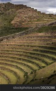 Inca ruins and terraces at Qantus Raqay in the Sacred Valley of the Incas in Peru.