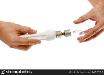 Incandescent and energy-saving lamp in the hands isolated on a white background