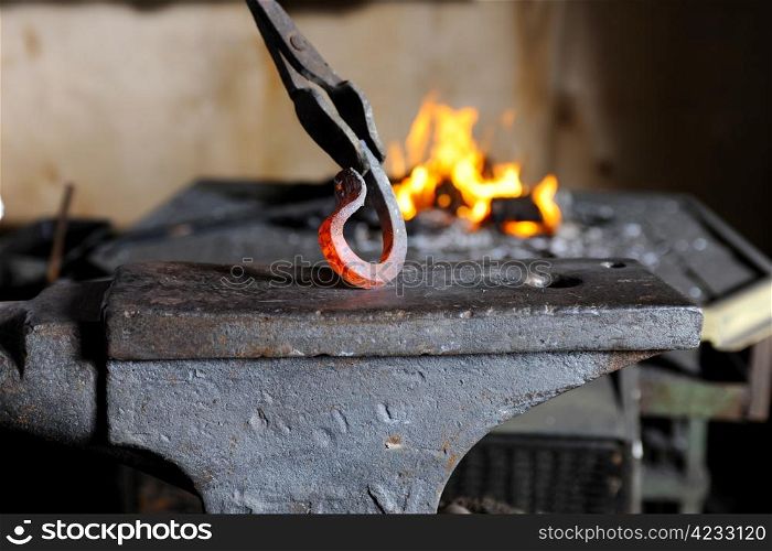 Incandescent element in the smithy on the anvil