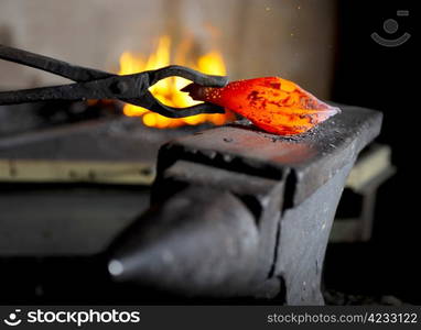 Incandescent element in the smithy on the anvil