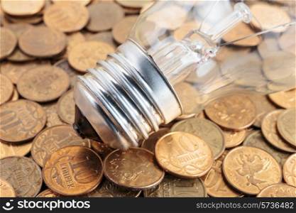 incandescent lamp on coins background