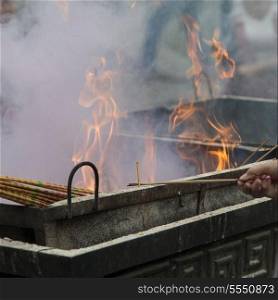 Incense sticks burning at a temple, Lama Temple, Dongcheng, Beijing, China