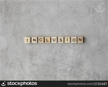 inclusion word written scrabble letters marble background
