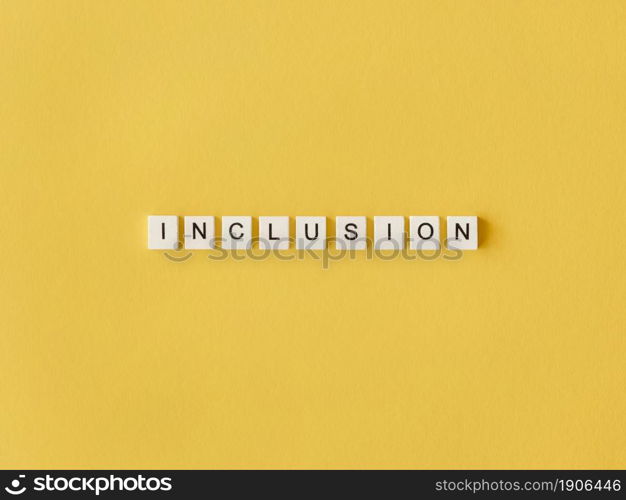 inclusion word written scrabble letters yellow background. High resolution photo. inclusion word written scrabble letters yellow background. High quality photo