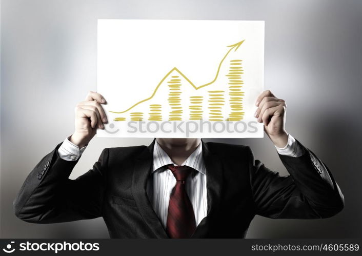 Income concept. Businessman hiding his face behind paper sheet with sketches