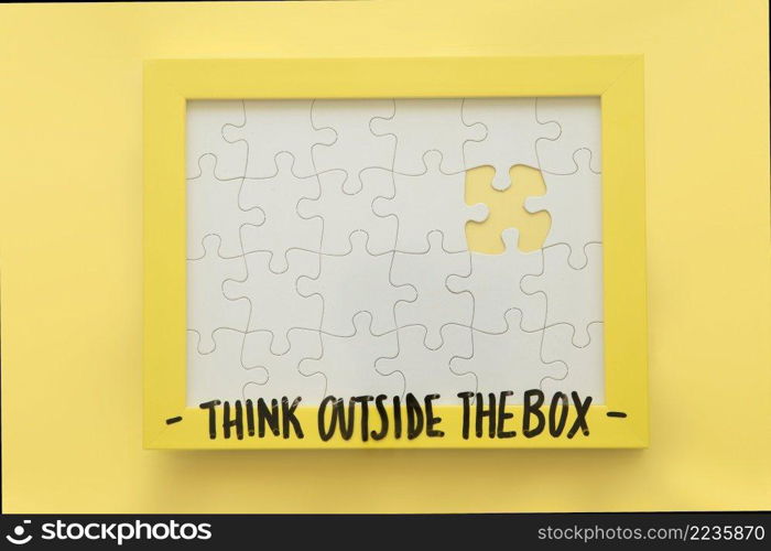 incomplete jigsaw puzzle frame with think outside box message
