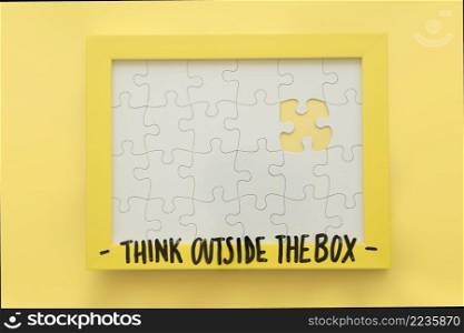 incomplete jigsaw puzzle frame with think outside box message