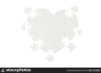 Incomplete jigsaw puzzle in a shape of a heart isolated on white