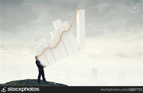 Increase your income. Businessman carrying graph bar growing concept in hands
