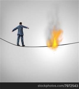 Increasing risk business concept and metaphor for overcoming adversity and dangers in following a risky strategy facing the end of the line as a businessman walking and hanging from a burning thread on a hazardous high wire.