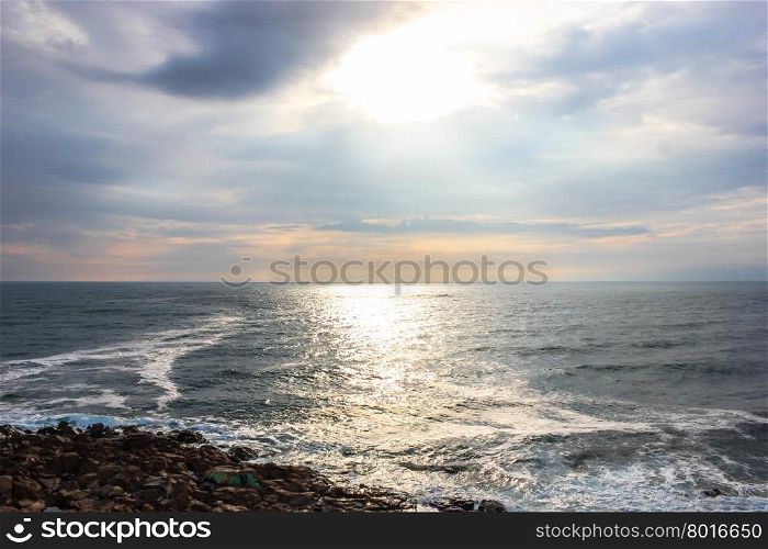 incredible sunset with cloudy sky to the rocky coast of Sozopol, Bulgaria
