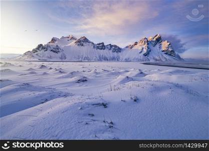 Incredible winter sunset scenery of the famous Vestrahorn mountains on Stokksnes cape, Iceland