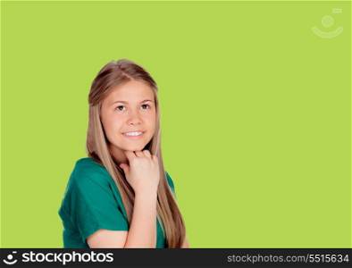 Indecisive girl looking up on green background